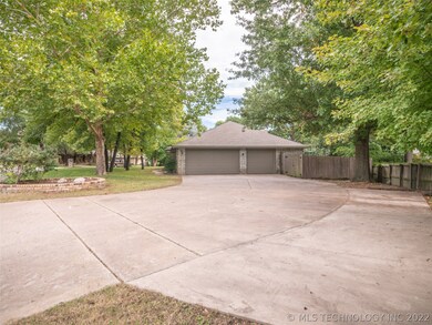 Huge driveway with oversized 3 car Garage with ple