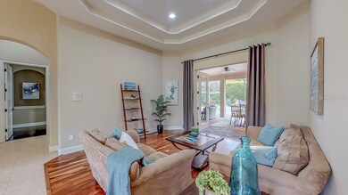 Formal living room with pool view.