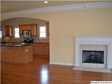 The spacious family room has 9' ceilings, crown mo
