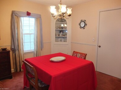 Formal dining room with chair rail and built-in co