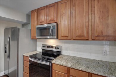 KITCHEN WITH STAINLESS STEEL APPLIANCES AND CUSTOM