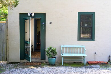Informal side entryway with laundry area.
