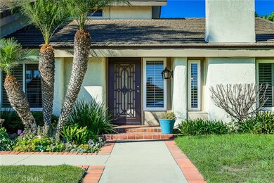 Upon arriving, you are welcomed by a well-maintained lawn leading you through a beveled glass door, inviting you into a gorgeous family home!  Locking decorative screen allows you to enjoy Fountain Valley's breezes.