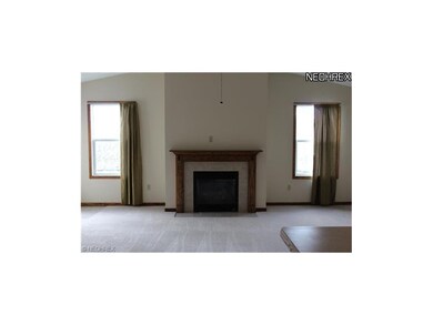 Living room features a gas fireplace.