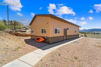 Side of home with drive up access.