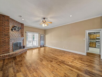 Unfurnished living room with crown molding, a text