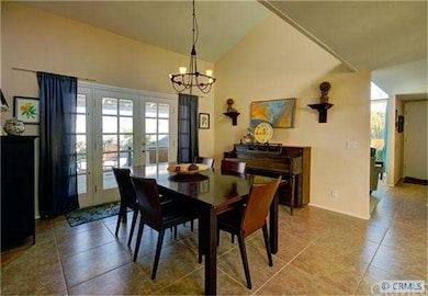 Separate formal dining room has French doors leadi