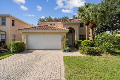 Mediterranean / spanish-style house with a garage