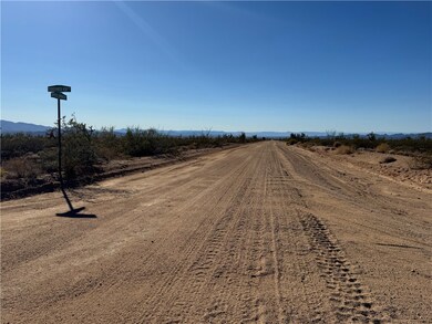 View of dirt / gravel road featuring a rural view