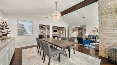 Elegant dining area with contemporary chandelier,