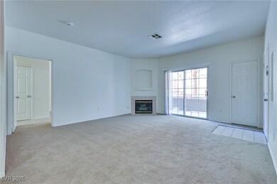 Unfurnished living room with light colored carpet,