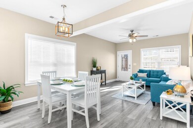 Dining area featuring a chandelier, light wood-sty