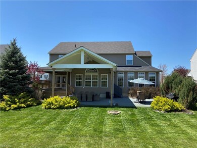 Rear view of covered porch and patio