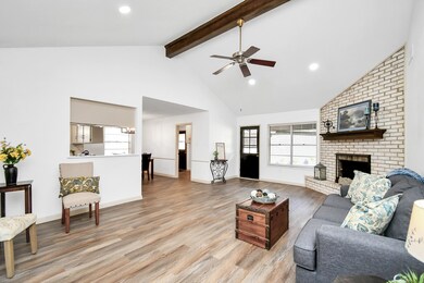 Main living area with vaulted ceiling