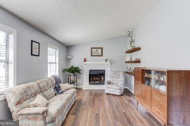 Great room with new flooring and fire place