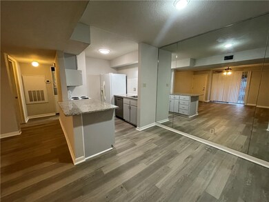 Kitchen featuring white refrigerator with ice disp