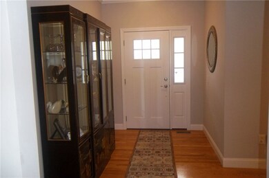 Entry foyer with hardwood floors