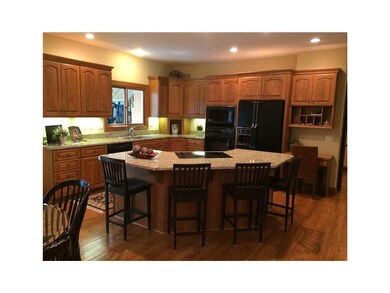 Kitchen. With granite countertops, breakfast bar/i