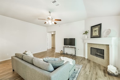 View of the living room from the dining room. There is plenty of room for all your seating arrangements.