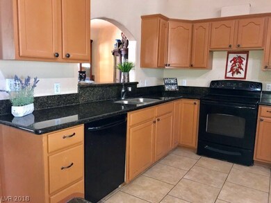 Lots of cabinets with tile flooring.