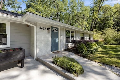 Property entrance featuring brick siding