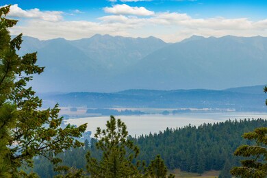 Close-up view of Flathead Lake backed by dramatic Swan Mountain peaks