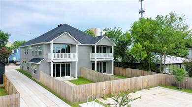 Back of property featuring a balcony and a shingle