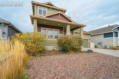 Front Exterior, Angled Left – Attractive diagonal view of the porch and front landscaping, emphasizing the home’s architectural character.