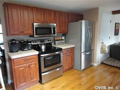 Kitchen New electric stove, microwave, and refrige