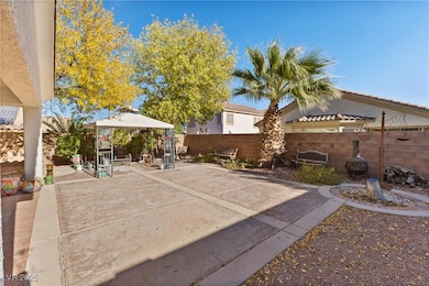View of patio / terrace featuring a gazebo and a f