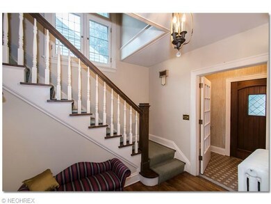 Front foyer, with tile entry, hardwood floors