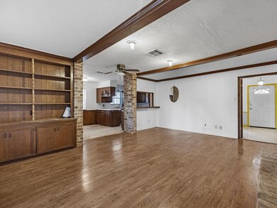 Family living room with beautiful ceiling beams.