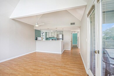 Kitchen with freestanding refrigerator, light wood