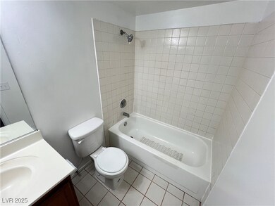 Full bathroom featuring tile patterned floors, van