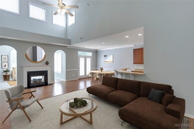 Living room with light wood-type flooring, ceiling
