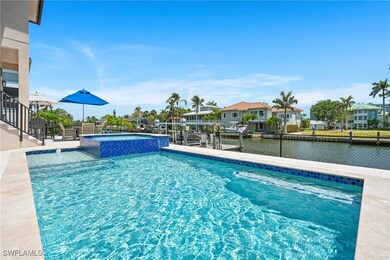View of pool with a pool with connected hot tub an