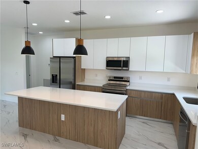 Kitchen featuring recessed lighting, marble finish