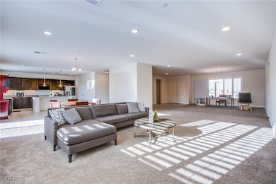 Living area featuring light colored carpet, recess