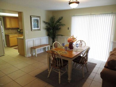 Dining area with tile flooring
