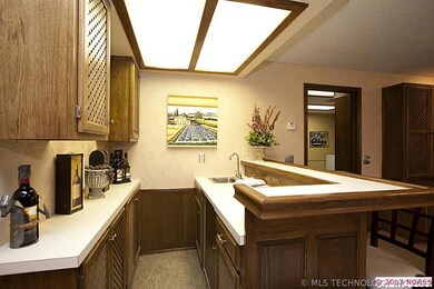 Bar in game room with sink and great storage. Bar