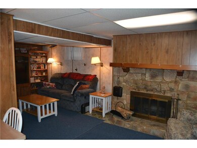 Cozy Family Room with Wood Burning Fireplace on lo