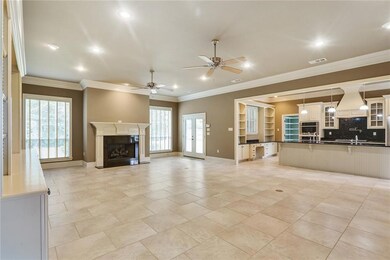 Large den with custom built ins, gas fireplace