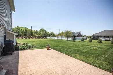 Rear yard includes a huge and functional stamped c