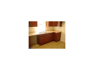 Newer kitchen cabinets and ceramic tile floors.