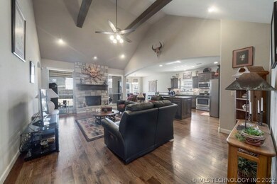 Beautiful hardwoods anchor the living room, kitche