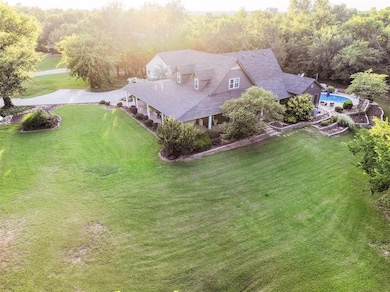 View from above of property featuring a forest