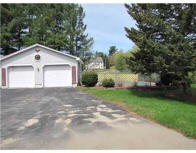 Exterior Front. Garage and pool area