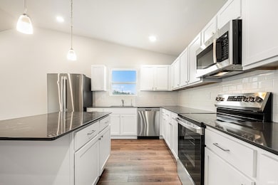 The kitchen includes Quartz counters with subway t
