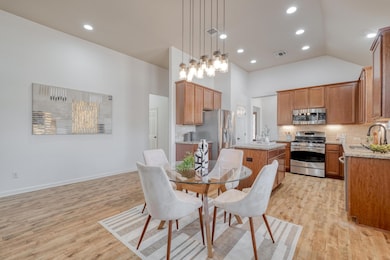 Dining area featuring light wood-style flooring,