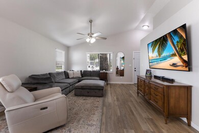 Vaulted Ceilings and fan in living room